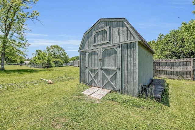 view of shed featuring fence