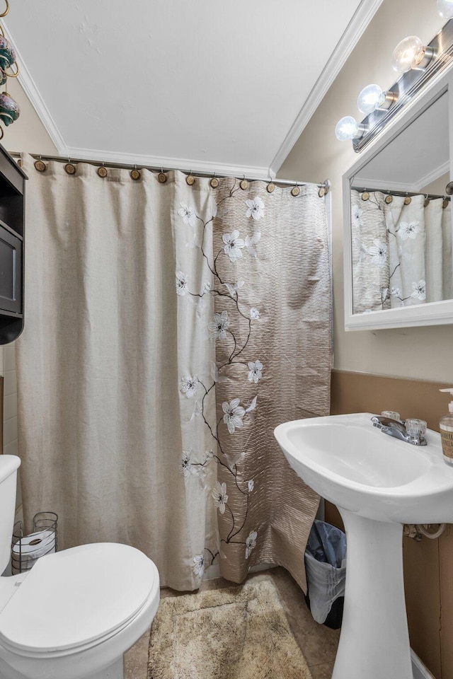 full bathroom with toilet, tile patterned flooring, and ornamental molding