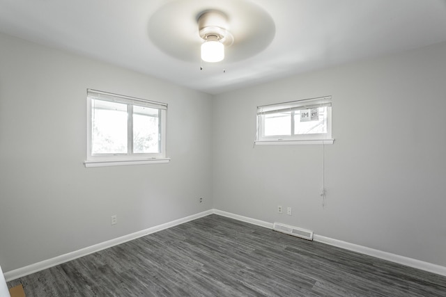 spare room with baseboards, visible vents, and a healthy amount of sunlight