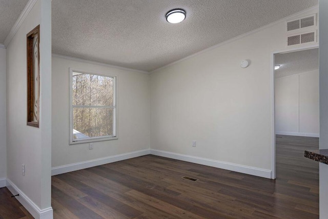 empty room with ornamental molding, visible vents, baseboards, and dark wood-style floors