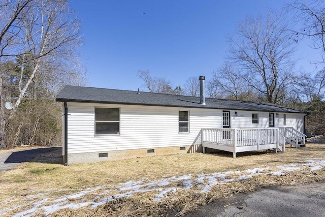 view of front facade featuring crawl space and a wooden deck