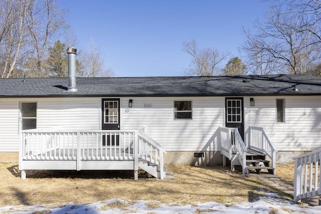 snow covered property with a wooden deck