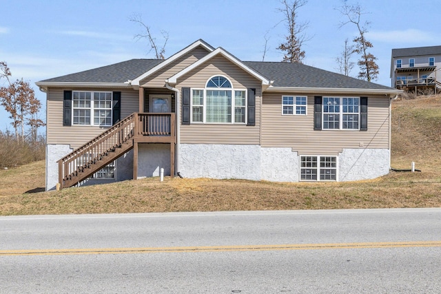 view of front of home featuring a shingled roof