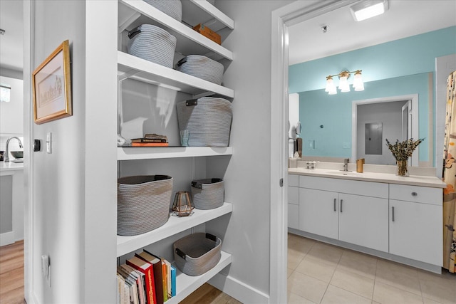 bathroom featuring tile patterned flooring and vanity