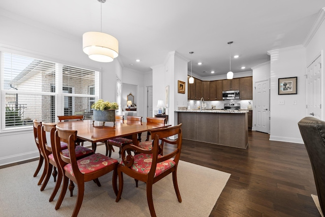 dining area featuring ornamental molding, dark wood-type flooring, recessed lighting, and baseboards