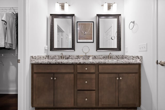 bathroom featuring double vanity and a sink