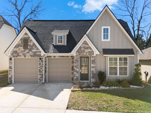 view of front of house with an attached garage, roof with shingles, board and batten siding, and concrete driveway