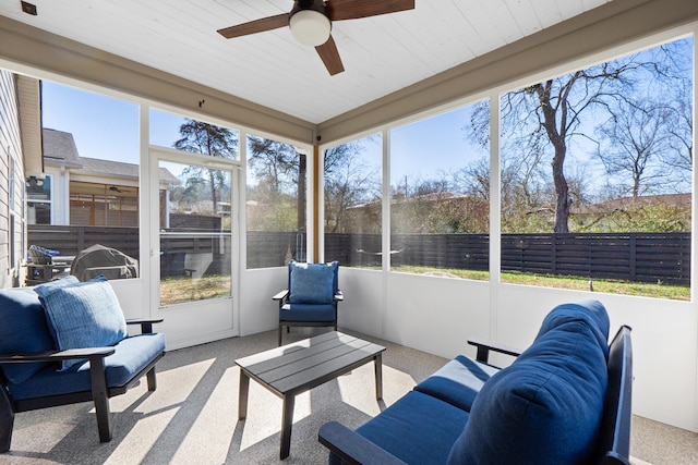 sunroom featuring a ceiling fan