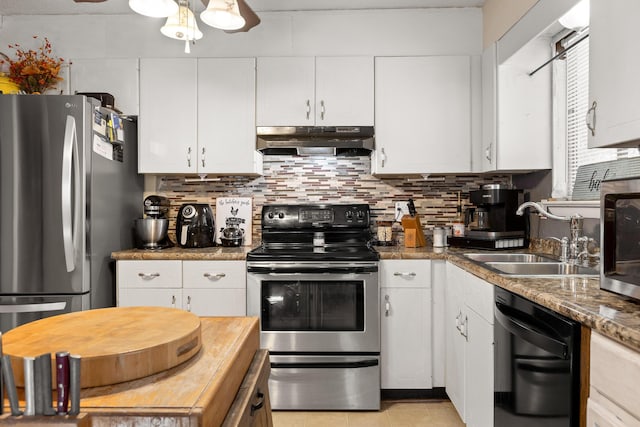 kitchen with under cabinet range hood, stainless steel appliances, a sink, white cabinets, and backsplash