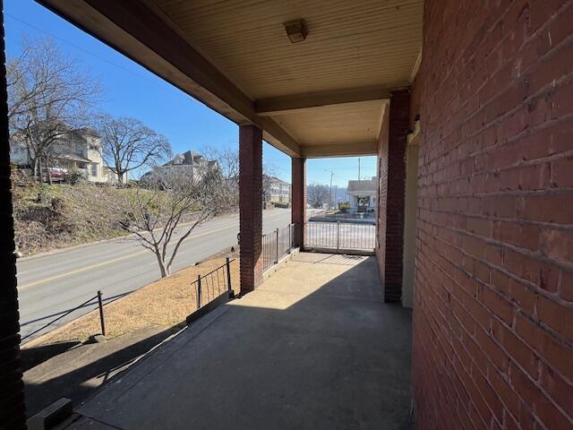 view of patio featuring a gate