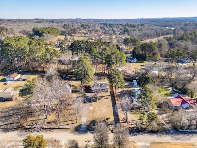 aerial view featuring a view of trees