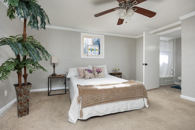 bedroom with ornamental molding, carpet, a ceiling fan, and baseboards