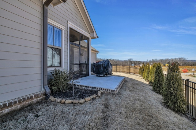 view of yard with a patio and fence