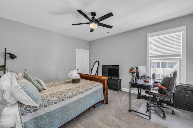 carpeted bedroom with ceiling fan, visible vents, and baseboards