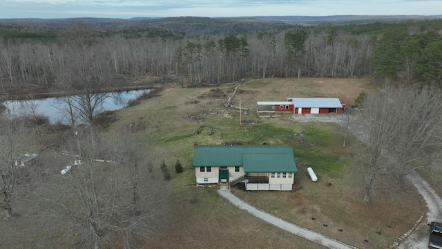 aerial view with a water view and a forest view