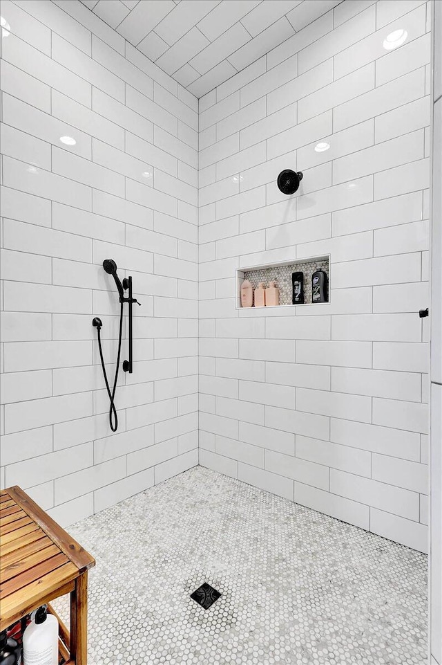 full bath featuring a tile shower