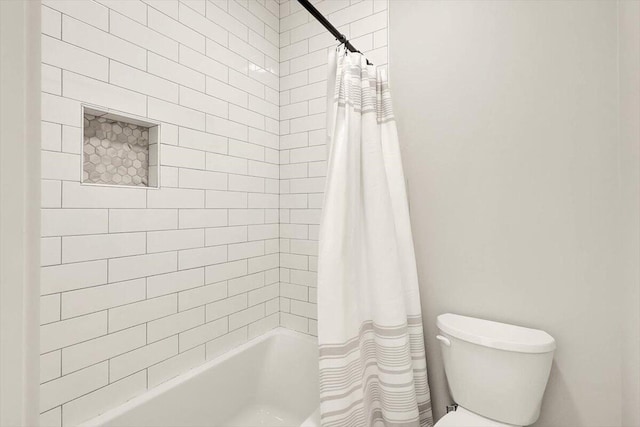 full bathroom featuring shower / tub combo and toilet