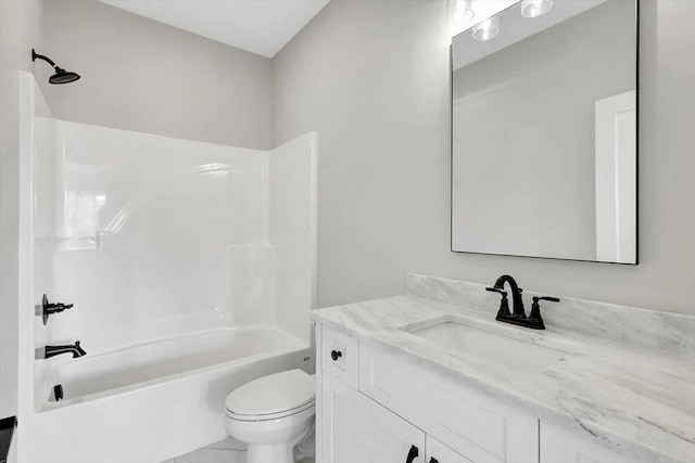 bathroom with toilet, tub / shower combination, and vanity