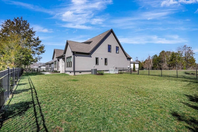 view of side of property with a yard, central AC unit, crawl space, and a fenced backyard