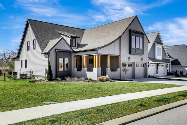 view of front of property featuring an attached garage, a shingled roof, fence, concrete driveway, and a front lawn