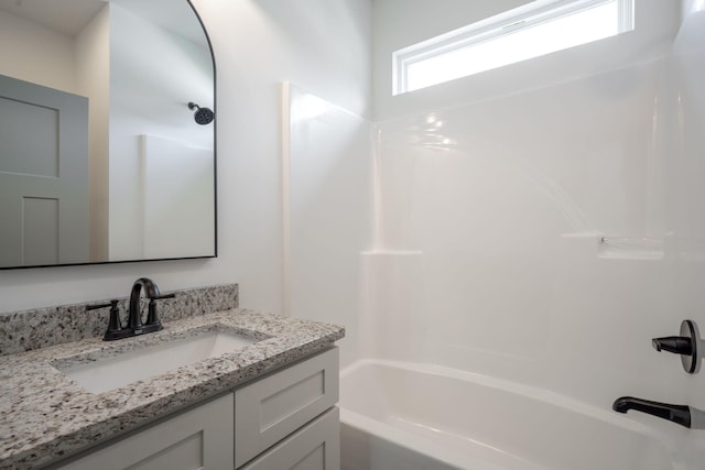 full bath with vanity and shower / bath combination