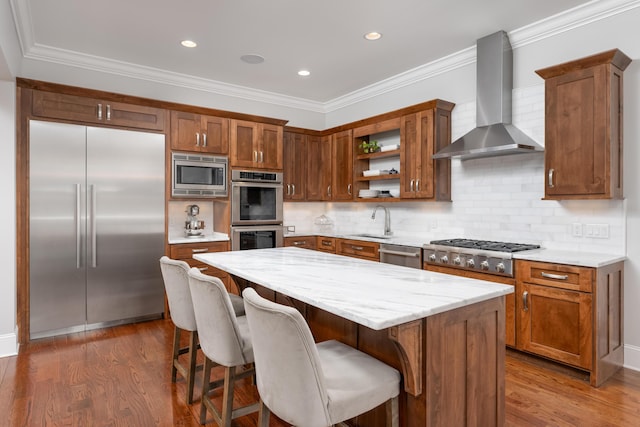 619 Hill Pointe Ln, Chattanooga, TN 37405 - kitchen with wall chimney range hood, brown cabinets, built in appliances, dark wood-style flooring, and a sink