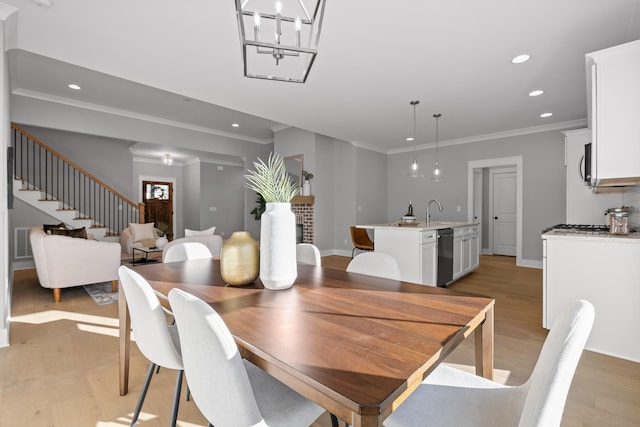 dining space featuring crown molding, stairway, light wood-type flooring, and recessed lighting