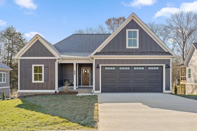 view of front of property with a garage, concrete driveway, roof with shingles, a front lawn, and board and batten siding