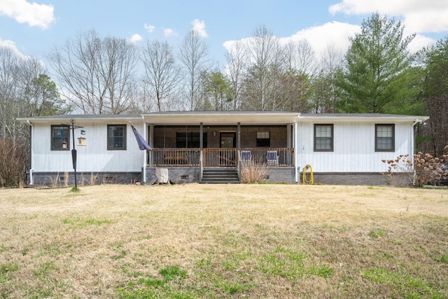 ranch-style home with covered porch, crawl space, and a front yard