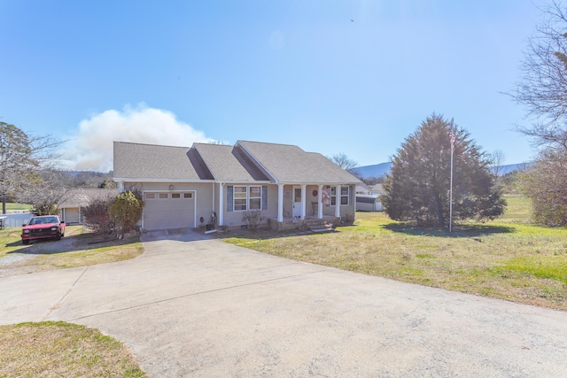 view of front facade with a garage, concrete driveway, and a front lawn