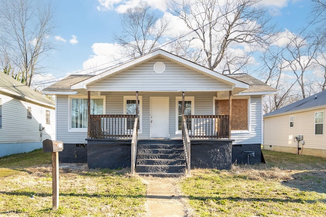 bungalow-style house featuring crawl space, a front lawn, and a porch