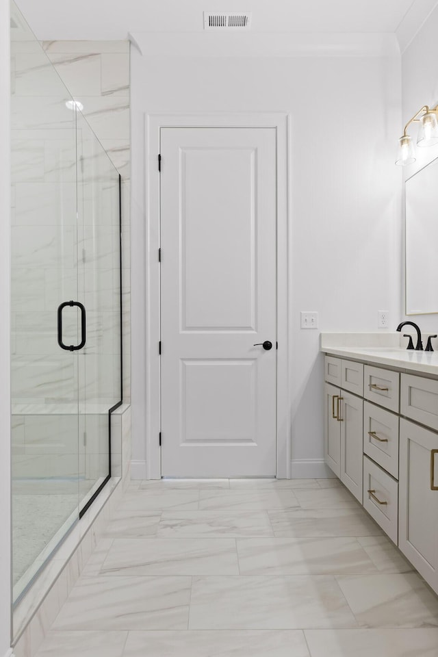 bathroom with baseboards, visible vents, crown molding, vanity, and a shower stall