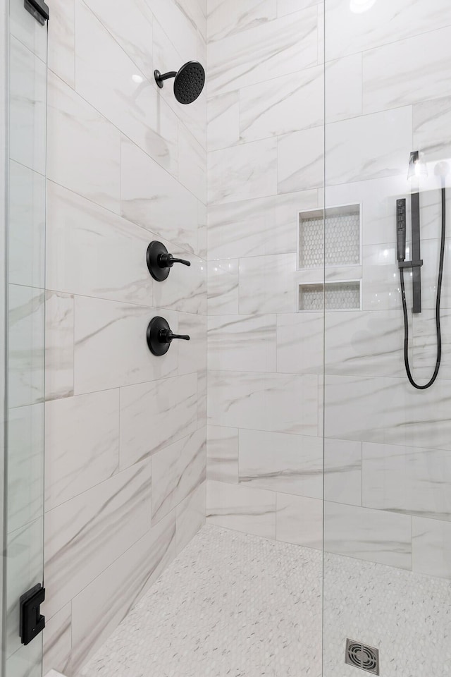 bathroom featuring a shower stall