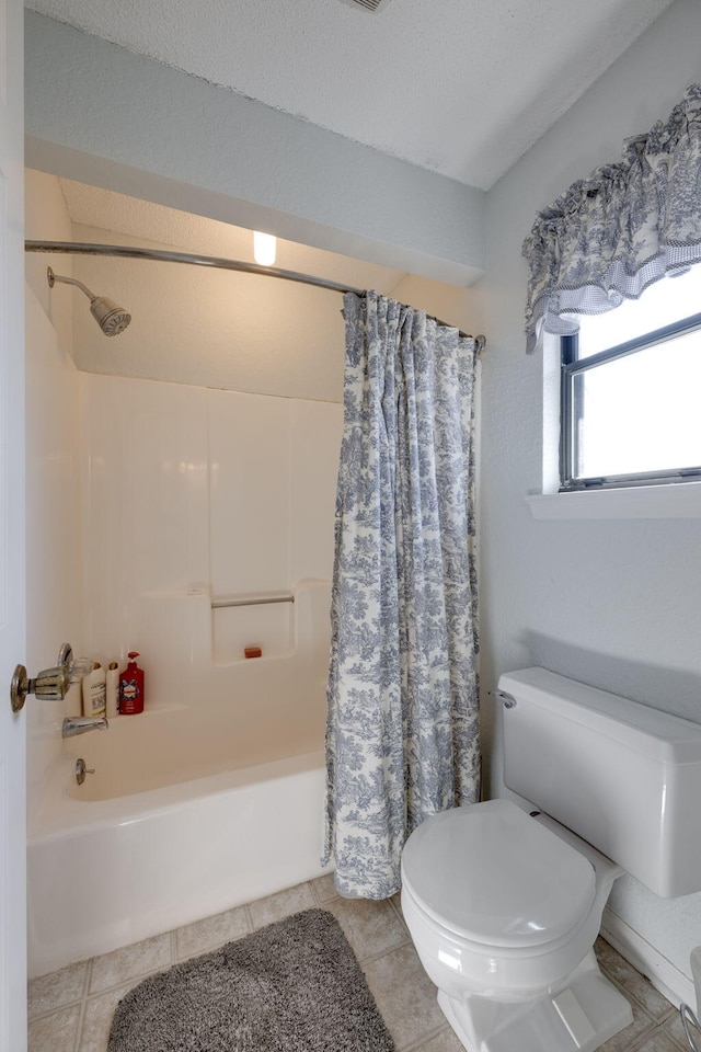 full bathroom with toilet, shower / tub combo, and tile patterned flooring