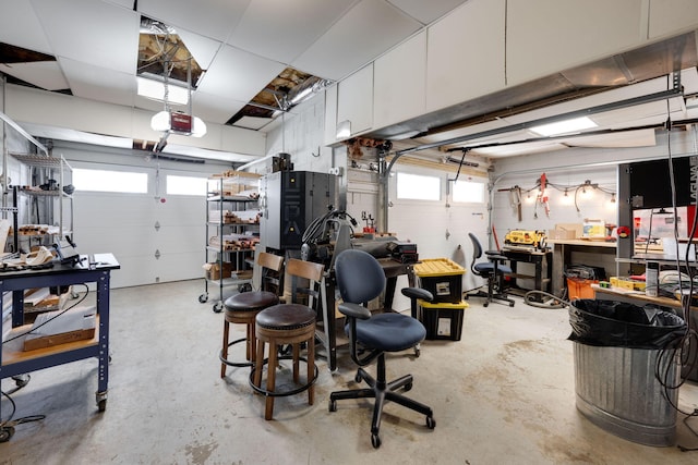 garage featuring a garage door opener and a workshop area