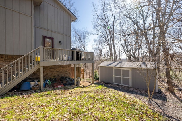 exterior space with a storage shed, a deck, stairway, and an outdoor structure