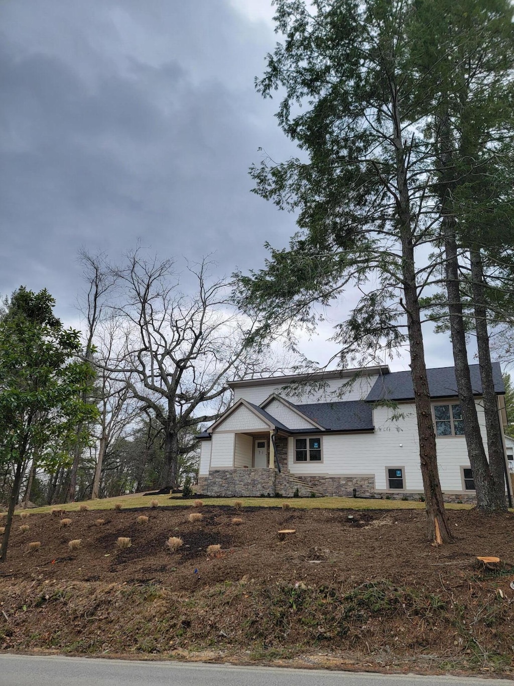 view of front of house with stone siding