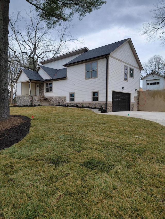 view of property exterior featuring an attached garage, stone siding, concrete driveway, and a yard