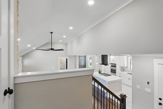 hallway with recessed lighting, light tile patterned floors, crown molding, and vaulted ceiling