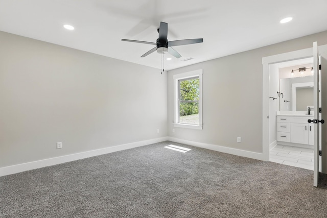 unfurnished bedroom featuring baseboards, recessed lighting, visible vents, and light carpet