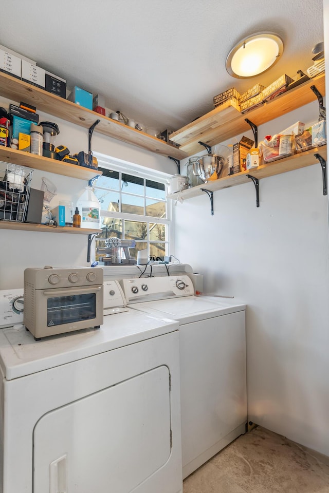 laundry area with laundry area and separate washer and dryer