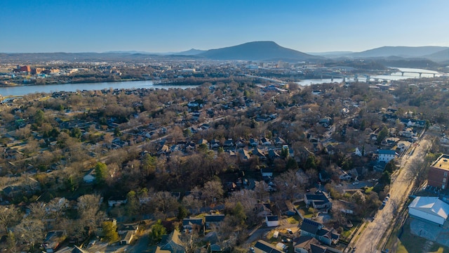 drone / aerial view featuring a water and mountain view