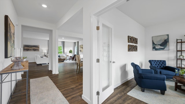 living area with recessed lighting, dark wood finished floors, and baseboards