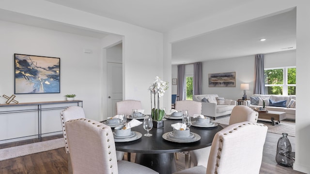 dining area with wood finished floors and recessed lighting