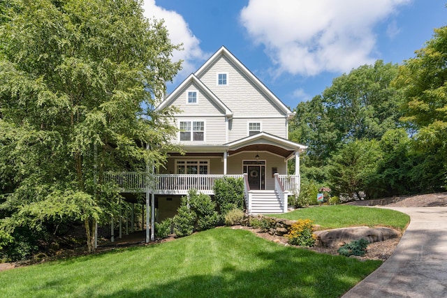 view of front facade with a porch and a front lawn