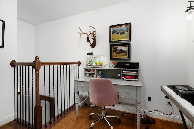 office with hardwood / wood-style floors and baseboards