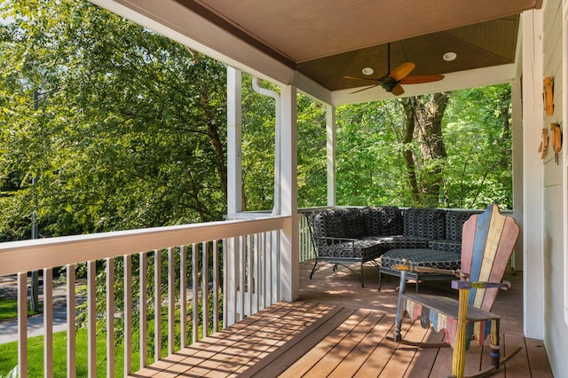 deck featuring an outdoor hangout area and a ceiling fan