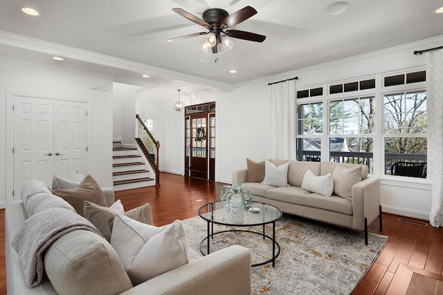 living area featuring recessed lighting, crown molding, stairway, and wood finished floors