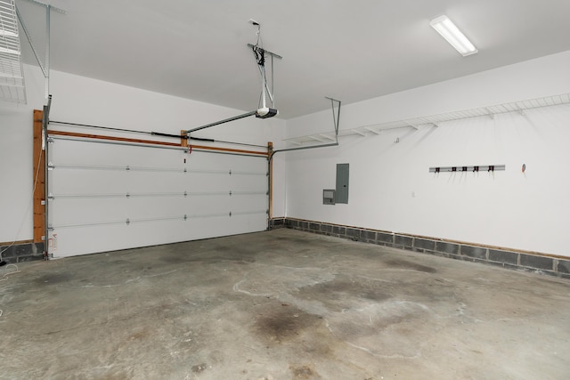 garage featuring a garage door opener and electric panel