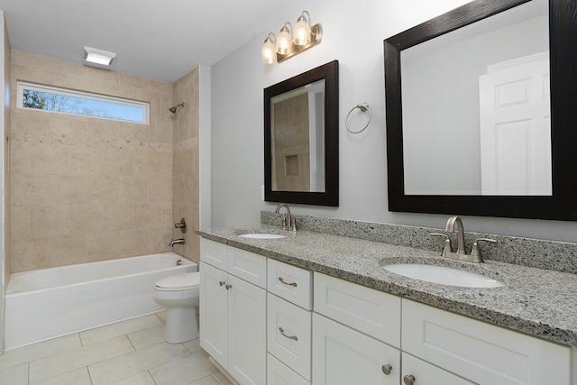 bathroom with toilet, bathing tub / shower combination, a sink, and tile patterned floors